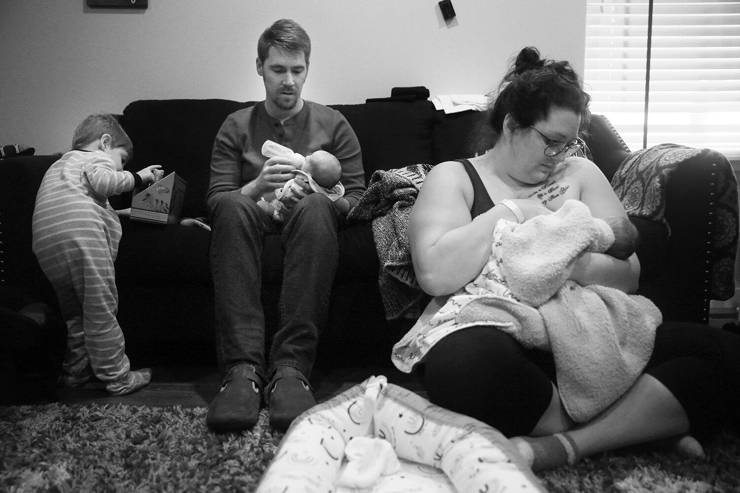Jalissa nurses Everleigh and Josh feeds Everett